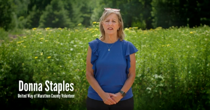 Woman talking with a field background