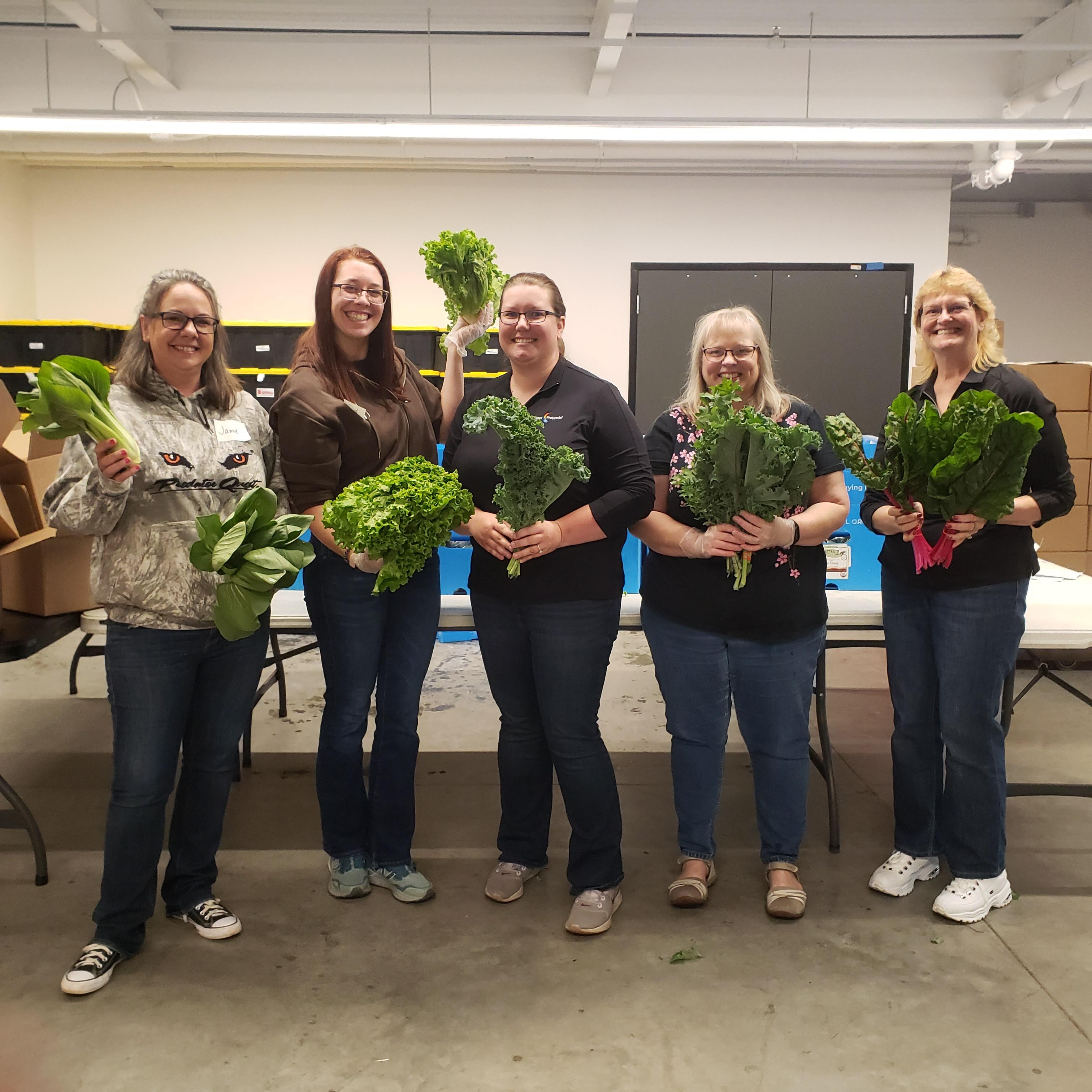volunteers with produce