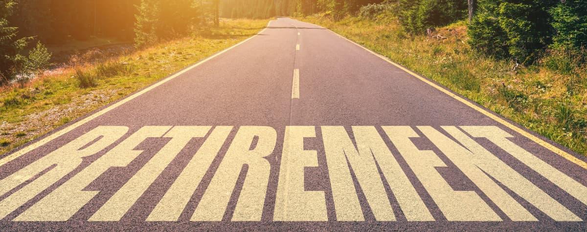 The word "retirement" on a paved road. 