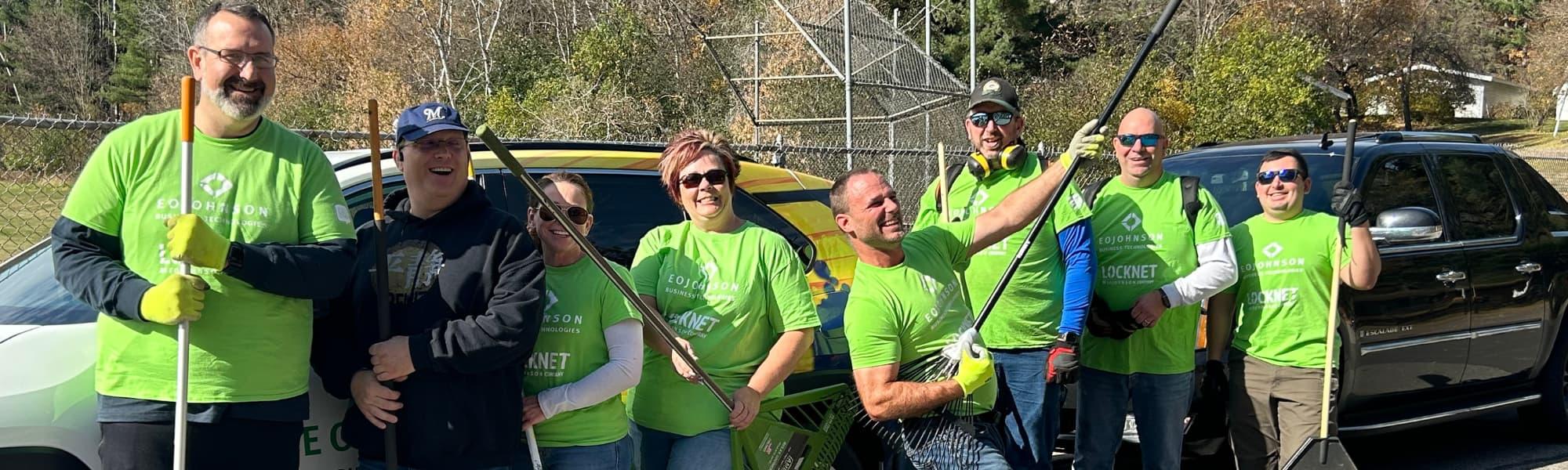 Group of people with rakes 